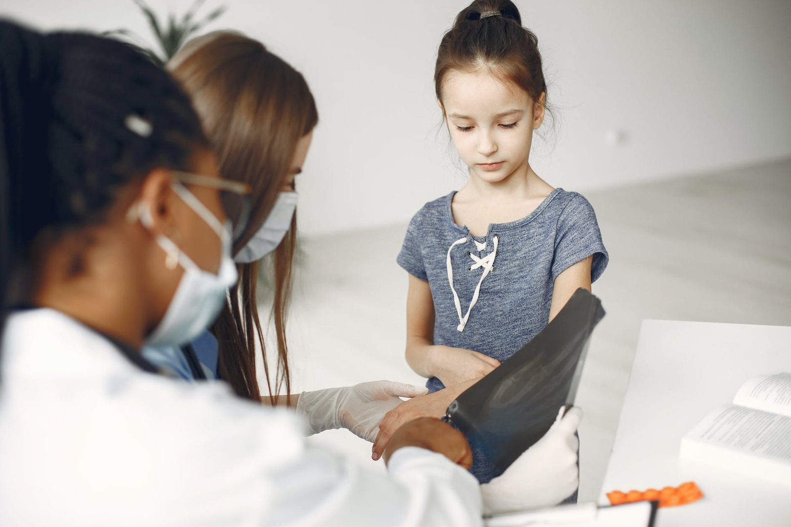 a young girl having a checkup at the clinic